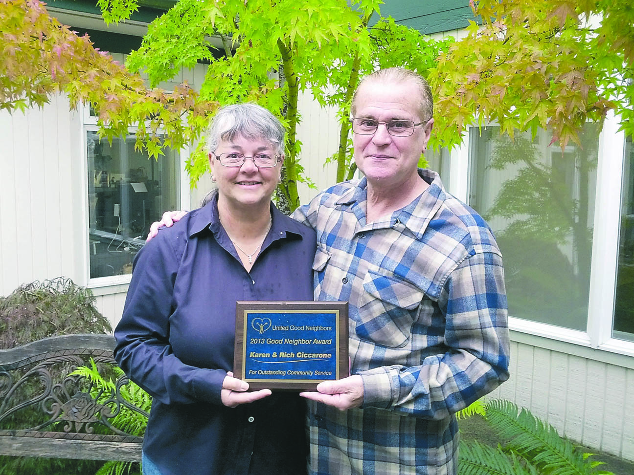 Karen and Rich Ciccarone of Port Hadlock were presented with a plaque for being the 2013 Good Neighbor Volunteers.