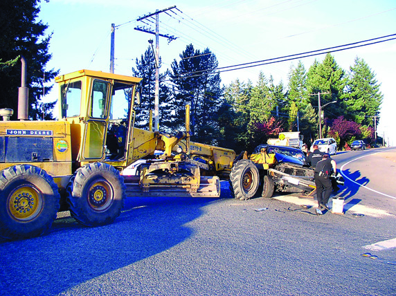 A GMC Jimmy SUV sits totaled on 16th Street in Port Angeles on Thursday. Port Angeles Police Department