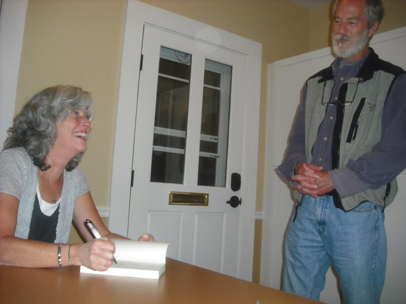 Erica Bauermeister signs one of her novels for Jim Thompson of Port Townsend at the event Thursday at the Library Learning Center. Margaret McKenzie/Peninsula Daily News