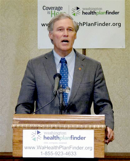 Gov. Jay Inslee speaks to the media about Washington state's new health insurance exchange during a news conference in Olympia on Monday. Rachel La Corte/The Associated Press