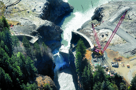 The Elwha River flows through a breach in the Glines Canyon Dam last week. Keith Thorpe/Peninsula Daily News