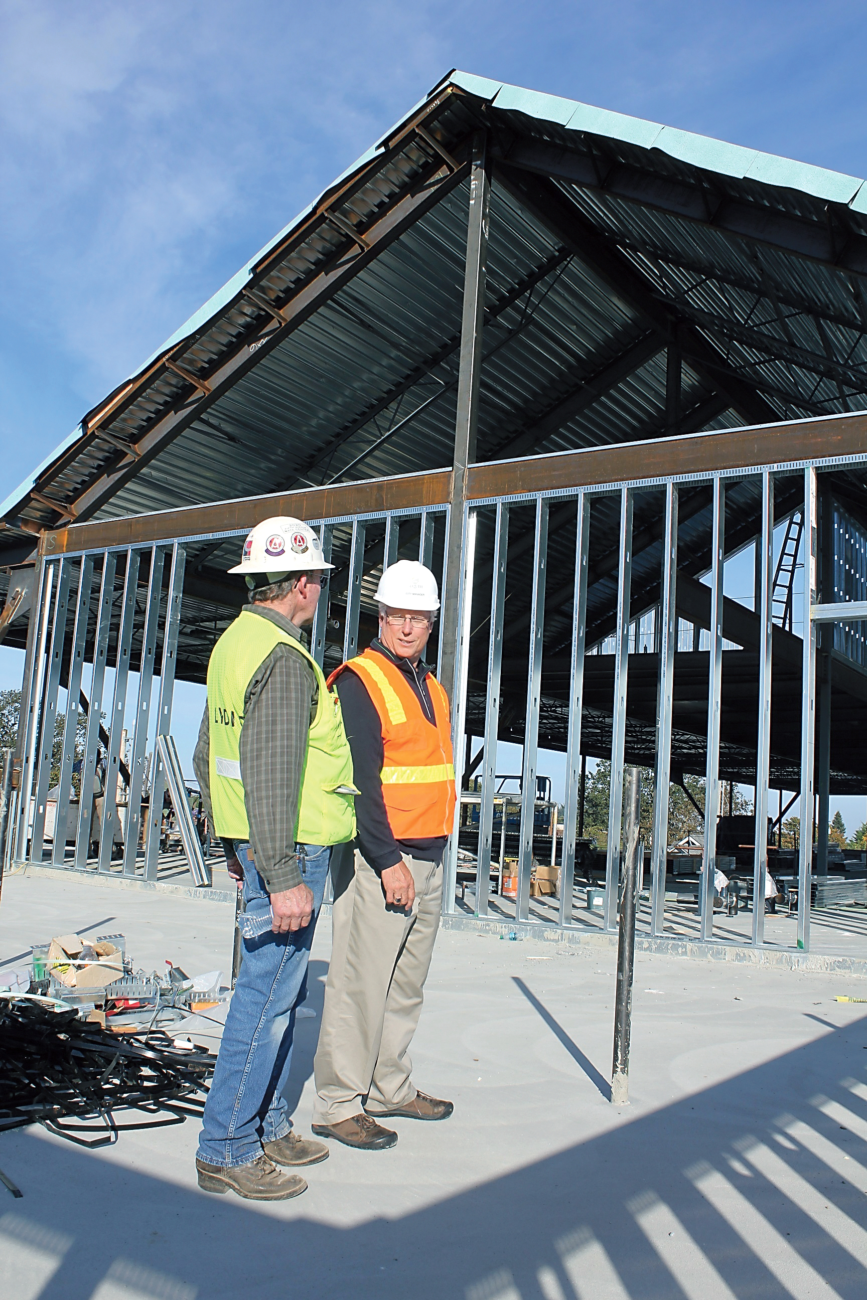 Lydig Construction project manager Ed Griffin and Sequim City Manager Steve Burkett discuss the construction progress on Sequim’s new civic center during a tour of the complex. Photo by Mark St.J. Couhig/Peninsula Daily News