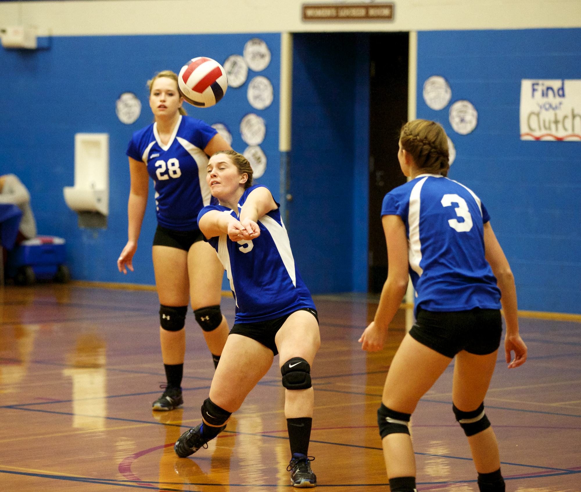 Chimacum's Lauren Thacker (28) and Olivia Baird (3) watch as teammate Taylor Carthum