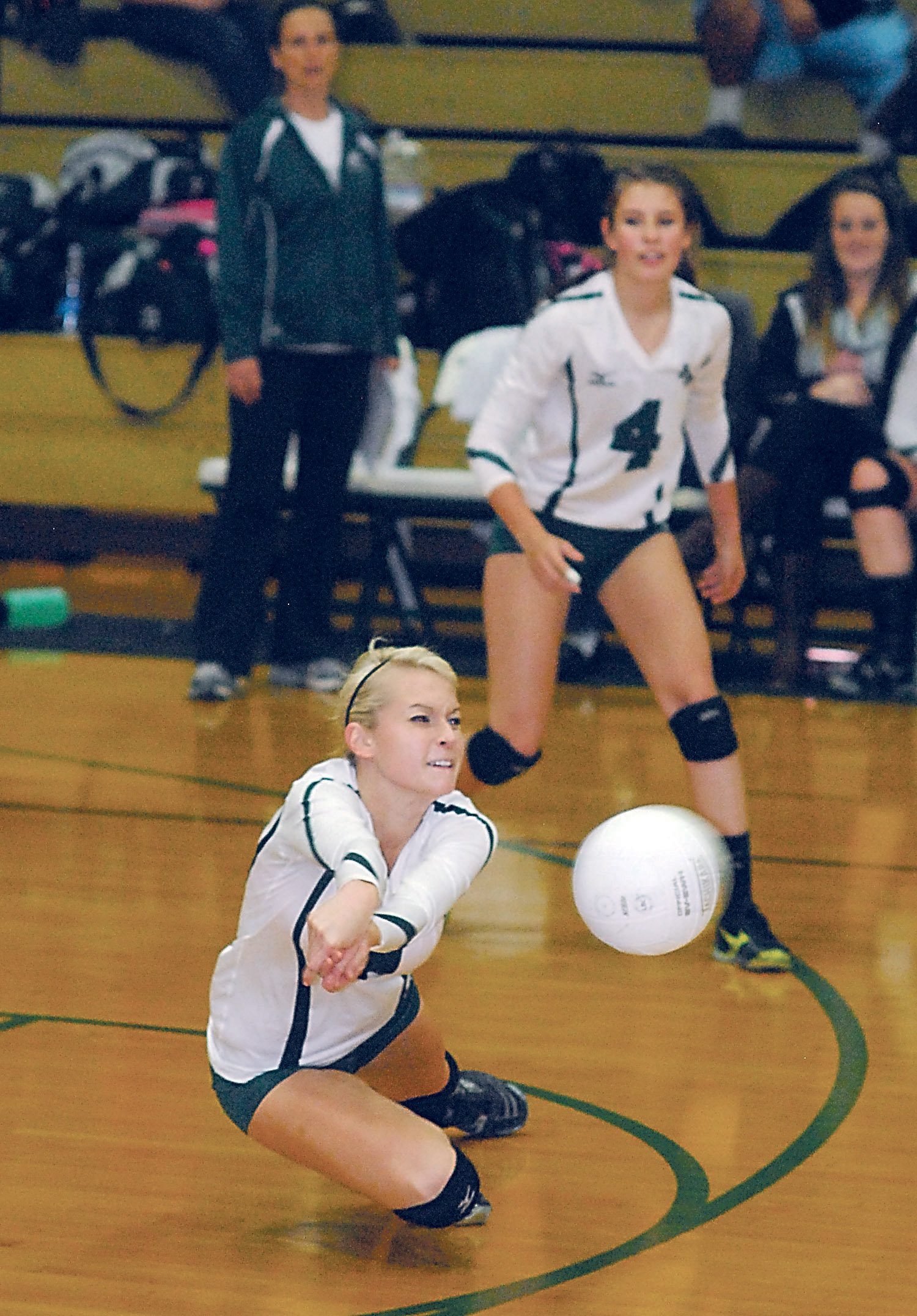 Port Angeles' Sarah Steinman gets the dig as teammate Alyssa Wetzler (4) looks on during the first set of the Roughriders' win over Klahowya. Keith Thorpe/Peninsula Daily News