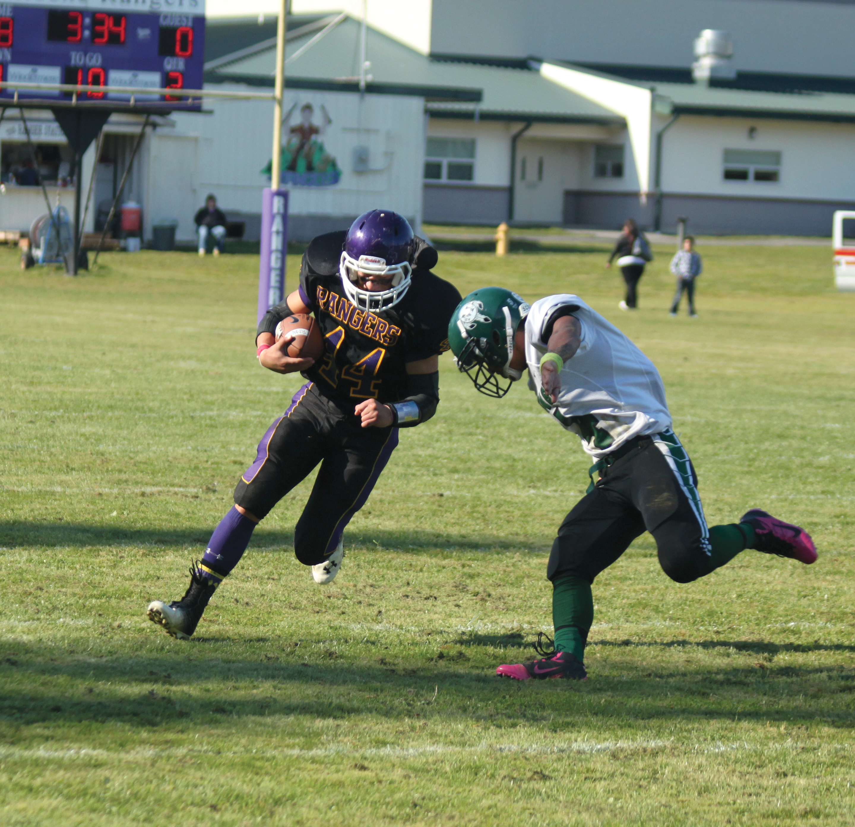 Quilcene running back Josh King prepares for impact during the Rangers' 30-0 win over Muckleshoot. Shawn King/for Peninsula Daily News