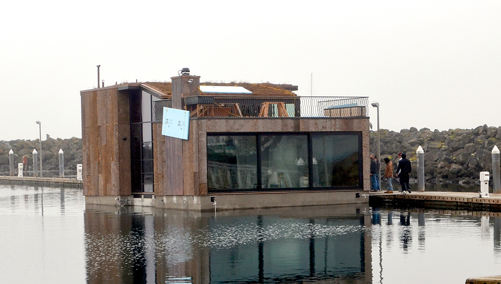 A floating home built by Little and Little Construction was put into the water at the Port Townsend Boat Haven on Wednesday in preparation for towing to Seattle.  -- Photo by Charlie Bermant/Peninsula Daily News