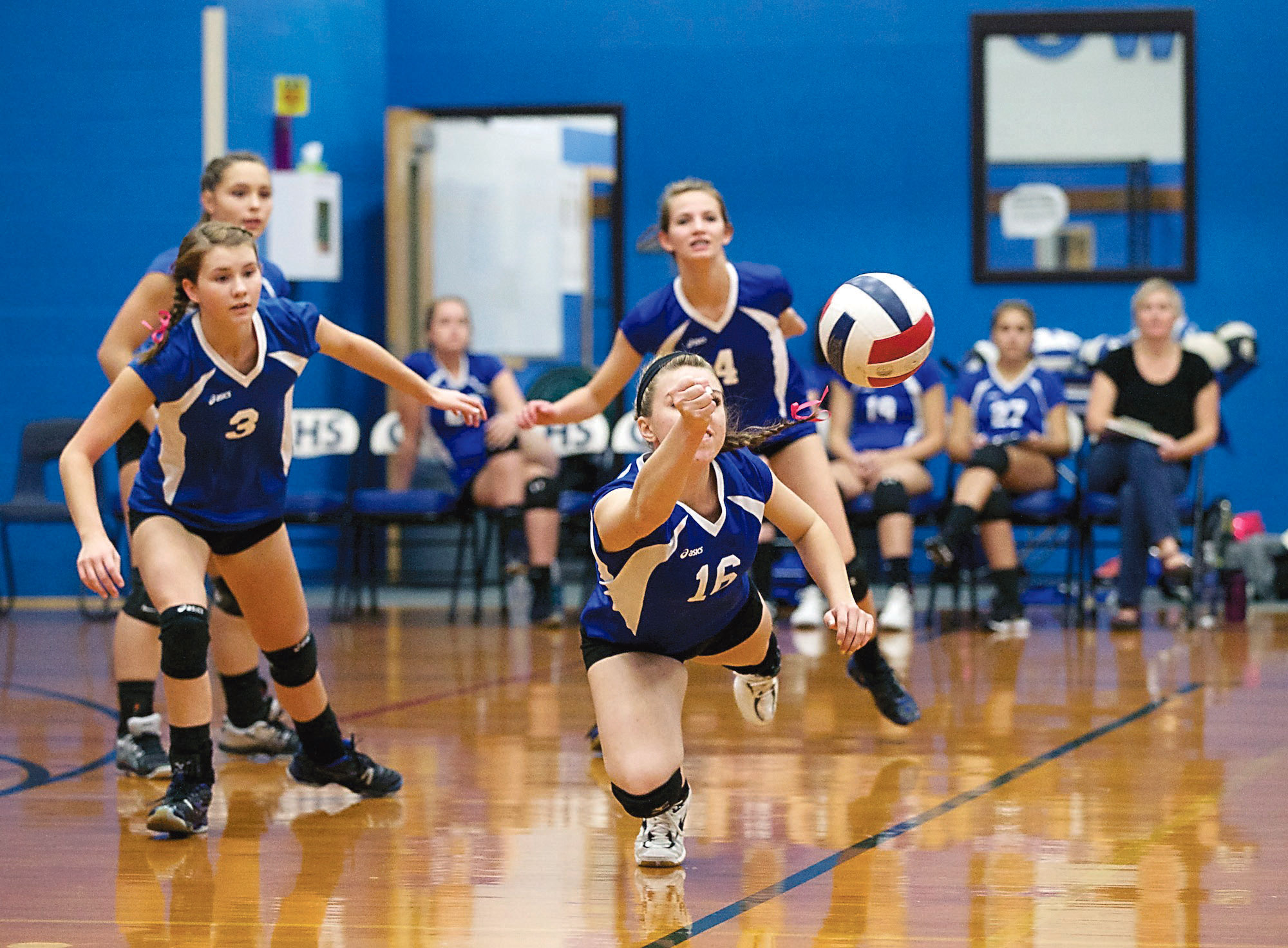 Chimacum's Alina Preston (16) dives for a return against Vashon Island. Steve Mullensky/for Peninsula Daily News