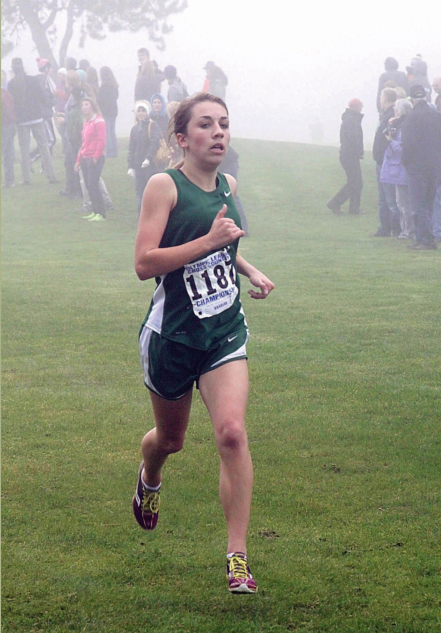 Elizabeth Stevenson led the Port Angeles girls team to victory with her fourth-place finish at the foggy Olympic League championship meet. Dave Logan/for Peninsula Daily News