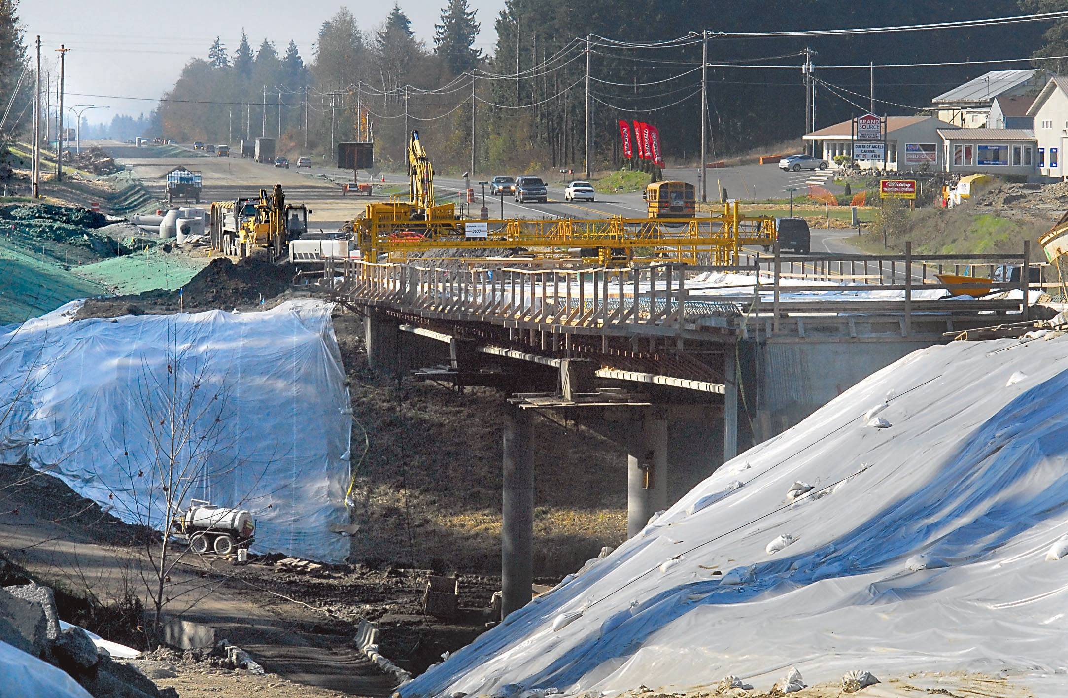 Traffic passes by a new bridge being built over McDonald Creek as part of a project to complete U.S. 101 as a four-lane highway between Port Angeles and Sequim.  -- Photo by Keith Thorpe/Peninsula Daily News