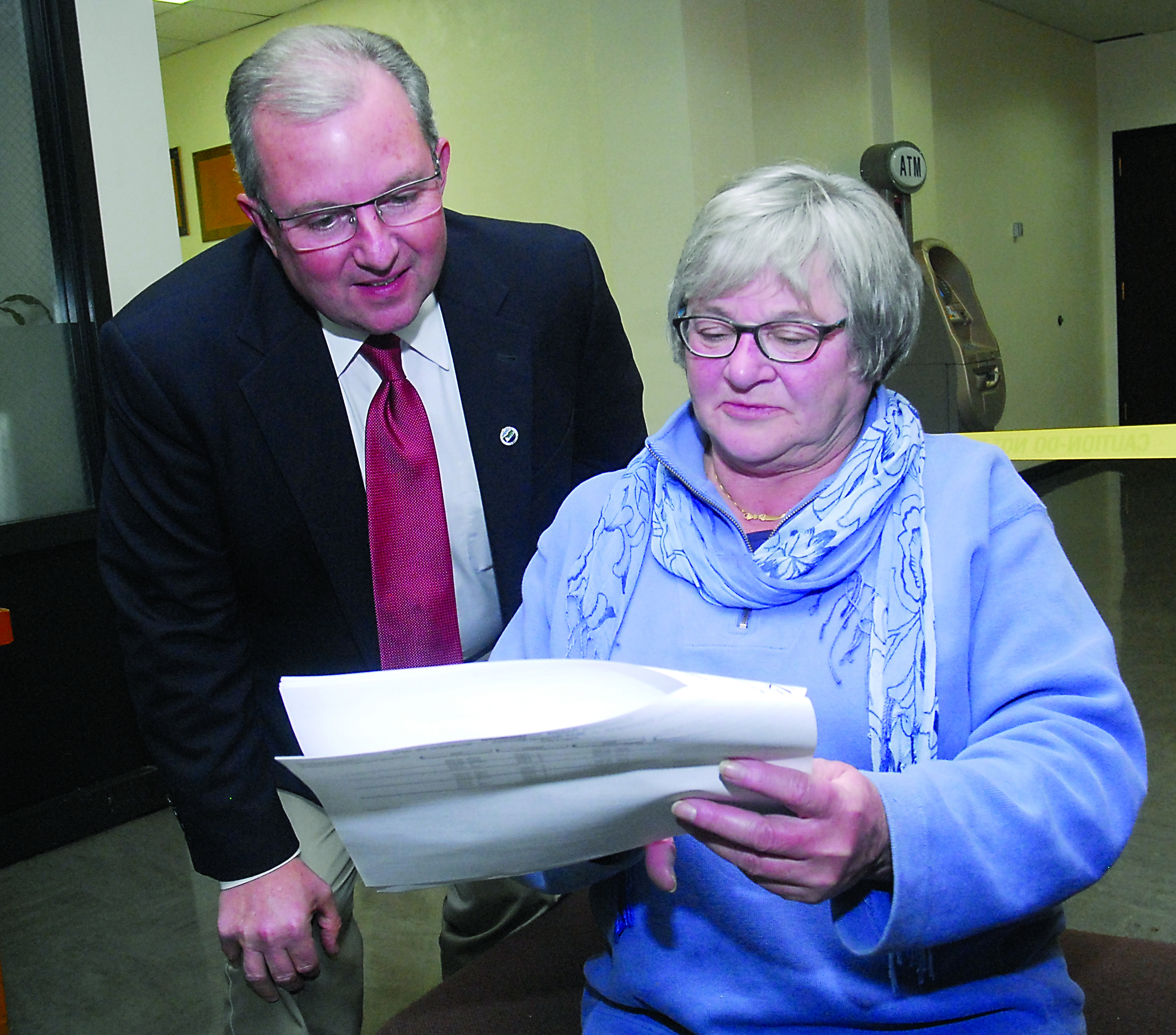 Olympic Medical Center Commissioner Jean Hordyk examines election results with Port Angeles City Councilman Dan Gase