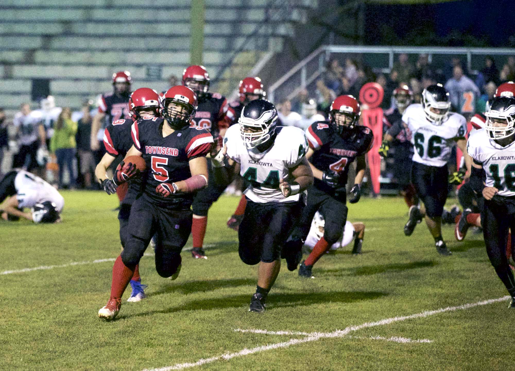 Port Townsend running back David Sua (5) runs off tackle and towards the end zone during the Redhawks' win over Klahowya in Port Townsend in September. Steve Mullensky/for Peninsula Daily News