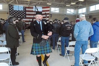 Bagpiper Thomas McCurdy plays "Amazing Grace" while marching out of the hanger during Veterans Day ceremonies at U.S. Coast Guard Air Station/Sector Field Office Port Angeles last November.— Keith Thorpe/Peninsula Daily News