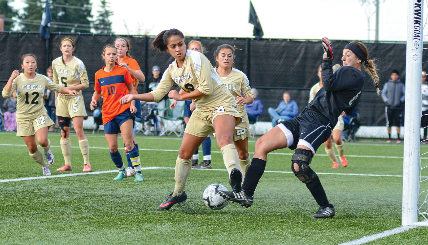 Peninsula College's Kai Mahuka manages to get enough of a foot on the ball to get it past Treasure Valley goalkeeper Tessa Pitzer and score the only goal of the game in the Pirates' 1-0 win in the NWAC quarterfinals. Jay Cline/for Peninsula Daily News