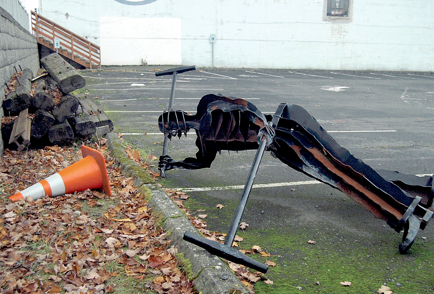 “The Gandy Dancer” lies alone in a parking lot this week after being unceremoniously uprooted from its waterfront post a year ago. --Photo by Paul Gottlieb/Peninsula Daily News