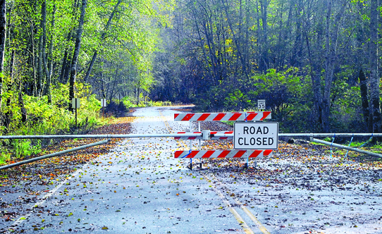 A barrier blocking access to Elwha Valley Road will be taken down Tuesday for its official opening to the public. Keith Thorpe/Peninsula Daily News