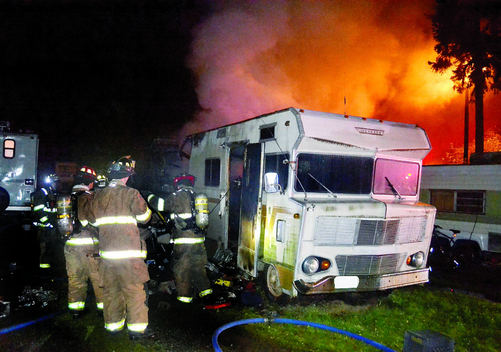 East Jefferson Fire-Rescue firefighters extinguish a blaze in a Winnebago recreational vehicle in Port Townsend earlier this week. Bill Beezley/East Jefferson Fire-Rescue