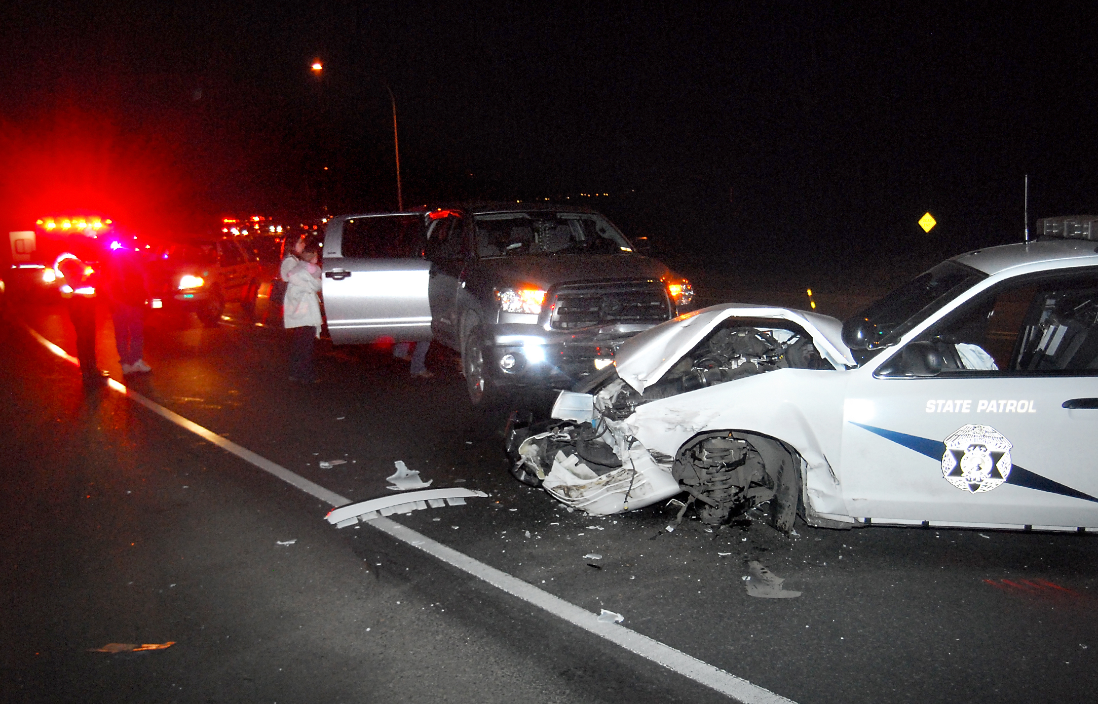 The 2011 Ford Crown Victoria patrol car is shown with the two other vehicles involved in Friday's collision at the bottom of the Morse Creek "S" curve on U.S. Highway 101 east of Port Angeles. Keith Thorpe/Peninsula Daily News