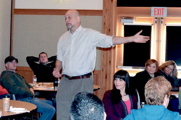 Facilitator Ellis Amdur addresses a roomful of law and safety employees during a domestic violence crisis intervention seminar on Tuesday.  —Photo by Charlie Bermant/Peninsula Daily News ­