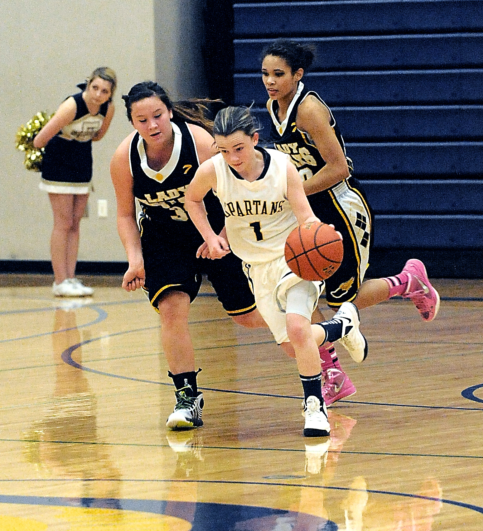 Forks' Skyler DeMatties (1) dribbles upcourt ahead of North Beach defender Mousie Shale