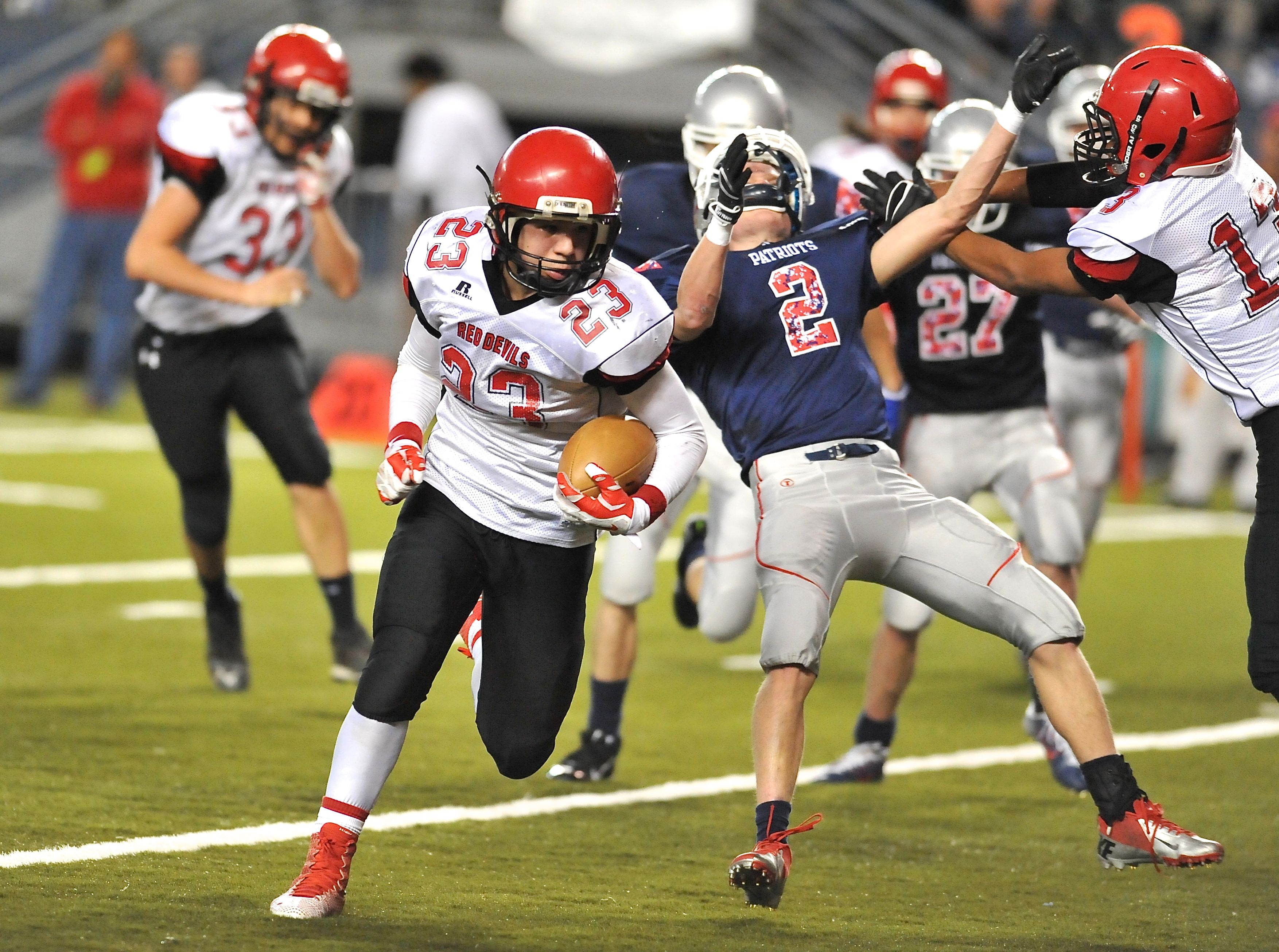 Neah Bay's Chris Martinez runs for a 16-yard touchdown in the second quarter with help from a block by quarterback Rwehabura Munyagi Jr.