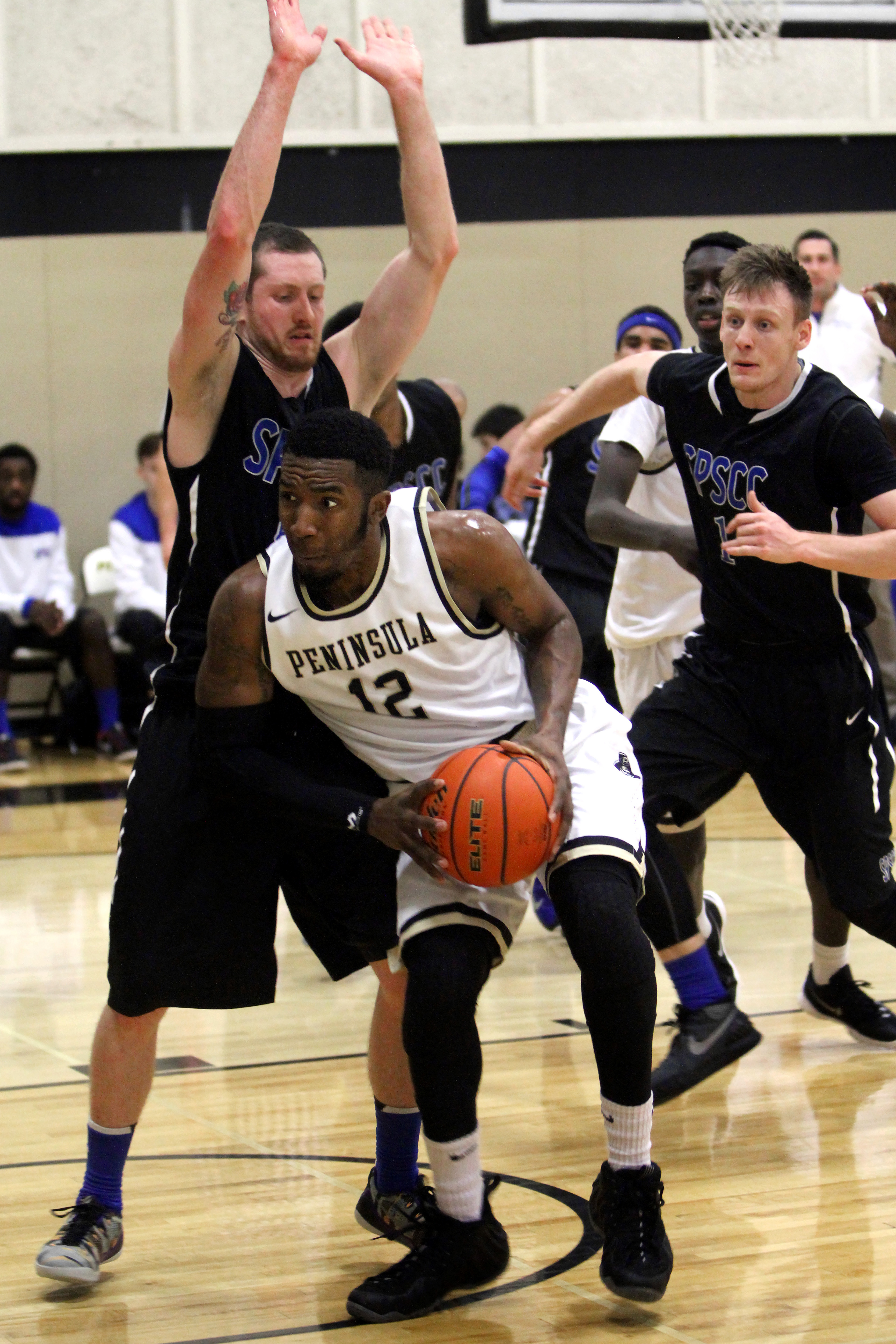 Peninsula sophomore Dimitri Amos (12) goes for a layup against South Puget Sound on the second day of the Pirates Classic at Peninsula College. Daniel Horton/for Peninsula Daily News