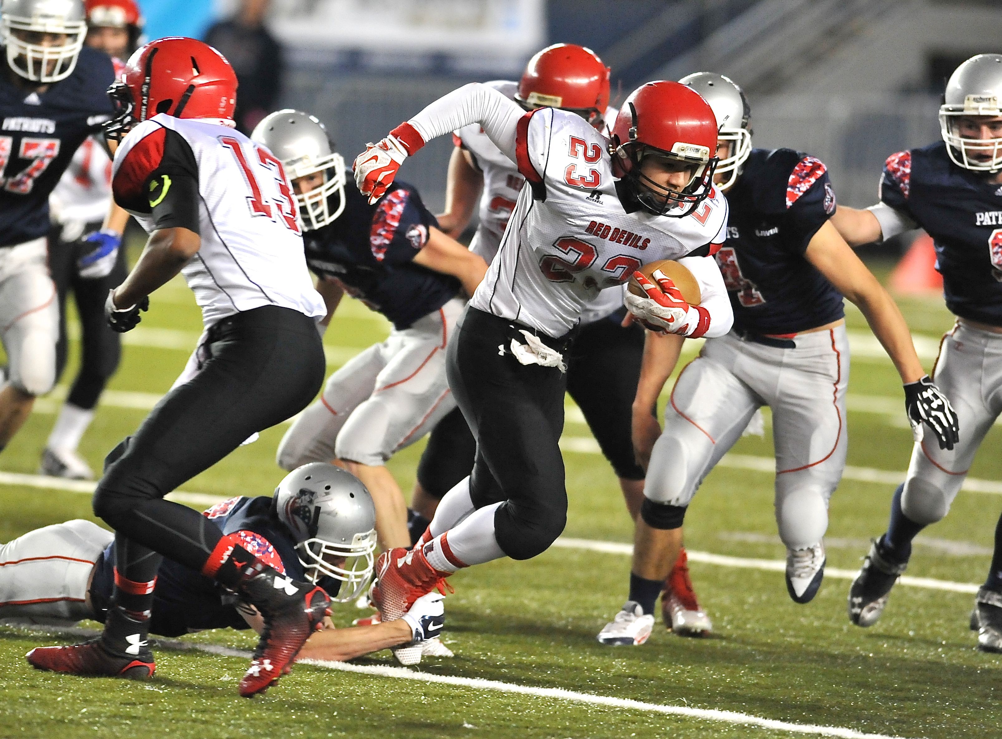 Neah Bay senior Chris Martinez (23) runs for a few of his 133 yards in the Class 1B state championship game at the Tacoma Dome