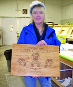 Johnnie Montice holds the cherry-wood capsule that was made for Port Angeles' sesquicentennial time capsule.