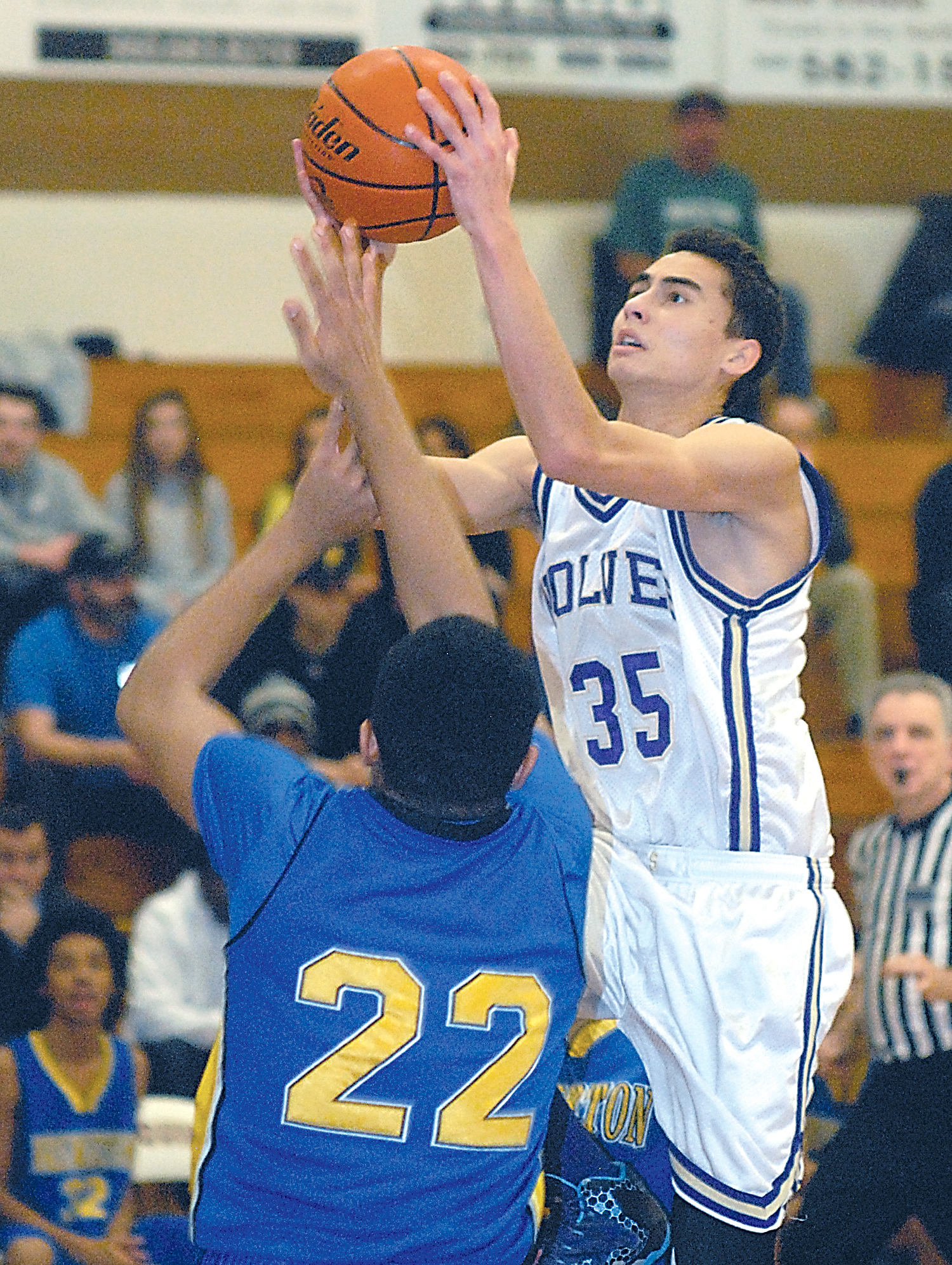 Sequim's Alex Barry goes up and over Bremerton's Teni Vaoifi for the layup in the second quarter Tuesday night at Sequim High School. Keith Thorpe/Peninsula Daily News