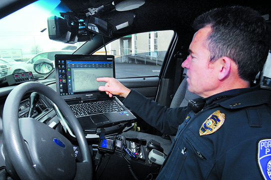 Deputy Police Chief Brian Smith shows how his cruiser's laptop connects to the city's new wireless network. Keith Thorpe/Peninsula Daily News