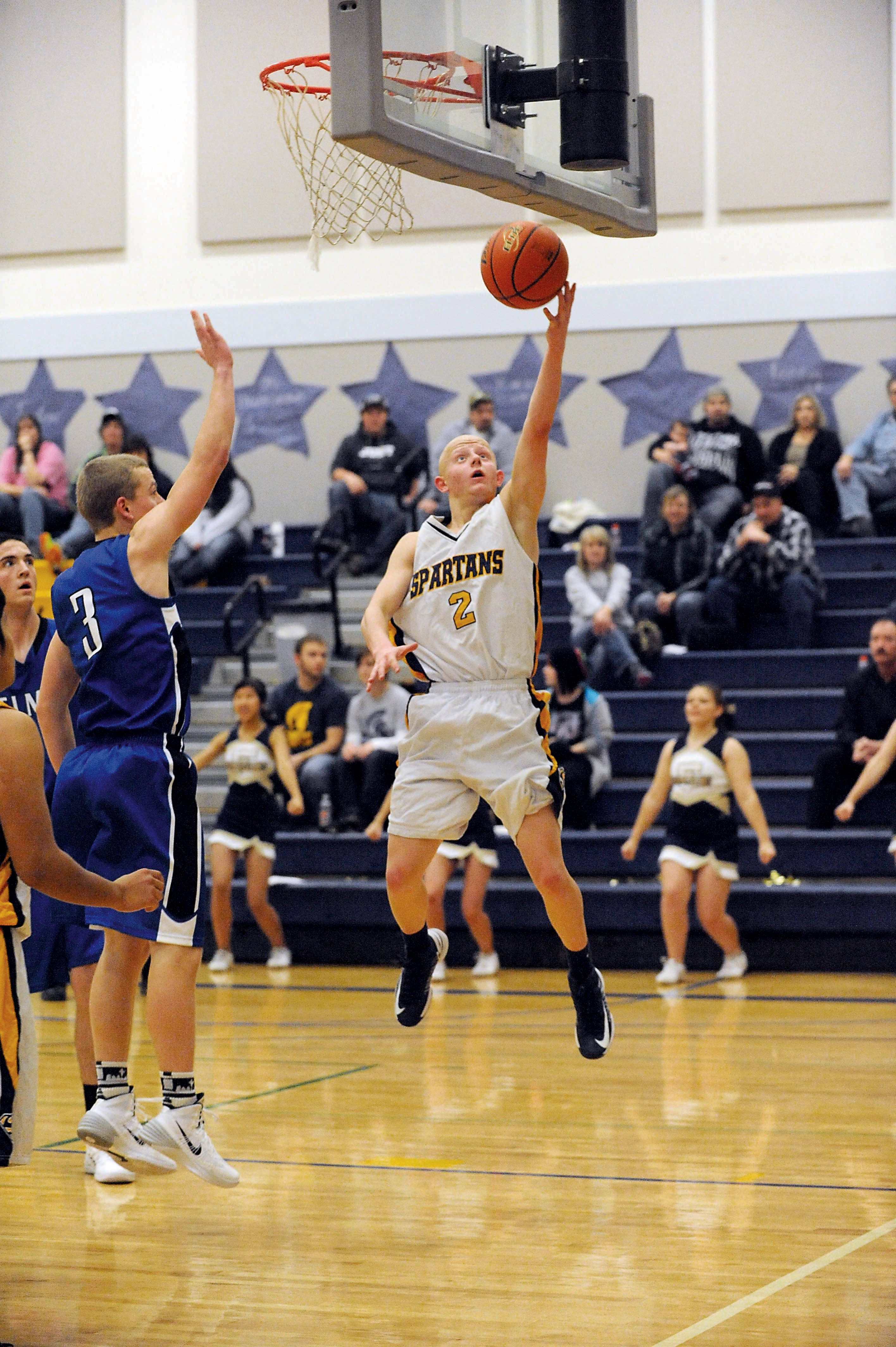 Forks guard Colton Raben (2) drives past the defense of Elma's Ryan Colton for a layup. Lonnie Archibald/for Peninsula Daily News