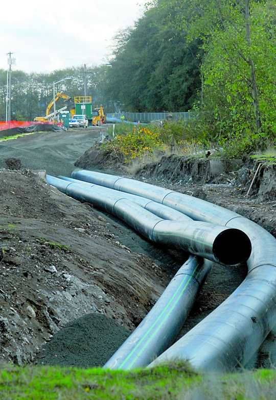 Sewer pipes wait for placement last month next to a section of the currently closed Waterfront Trail near the site of the former Rayonier mill in Port Angeles. Keith Thorpe/Peninsula Daily News