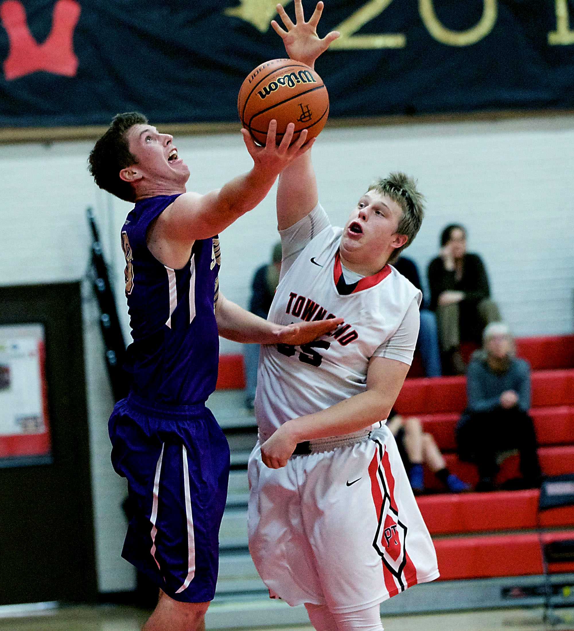 Port Townsend's Kaiden Parcher (55) tries to block a shot by Sequim's Jack Shea. Steve Mullensky/for Peninsula Daily News