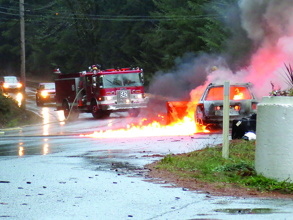 A fire engulfs a car in Brinnon earlier this week. Brinnon Fire Department