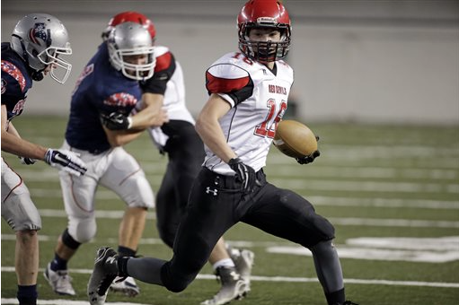 Neah Bay's Cole Svec carries against Liberty Christian in the first half of the state Class 1B championship game at the Tacoma Dome on Dec. 6. The Associated Press