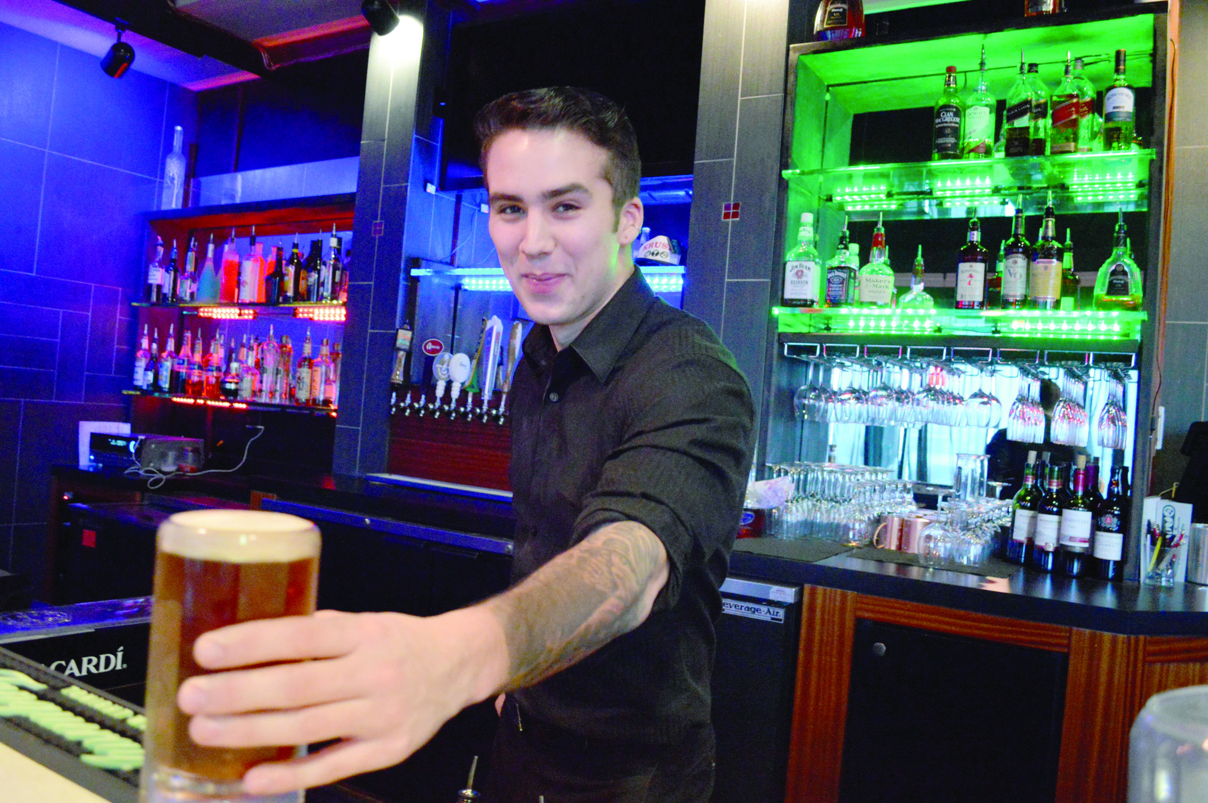 Bartender James Finnen serves up a beer at Krush Ultra Lounge at 10181 Old Olympic Highway in Sequim. — Joe Smillie/Peninsula Daily News