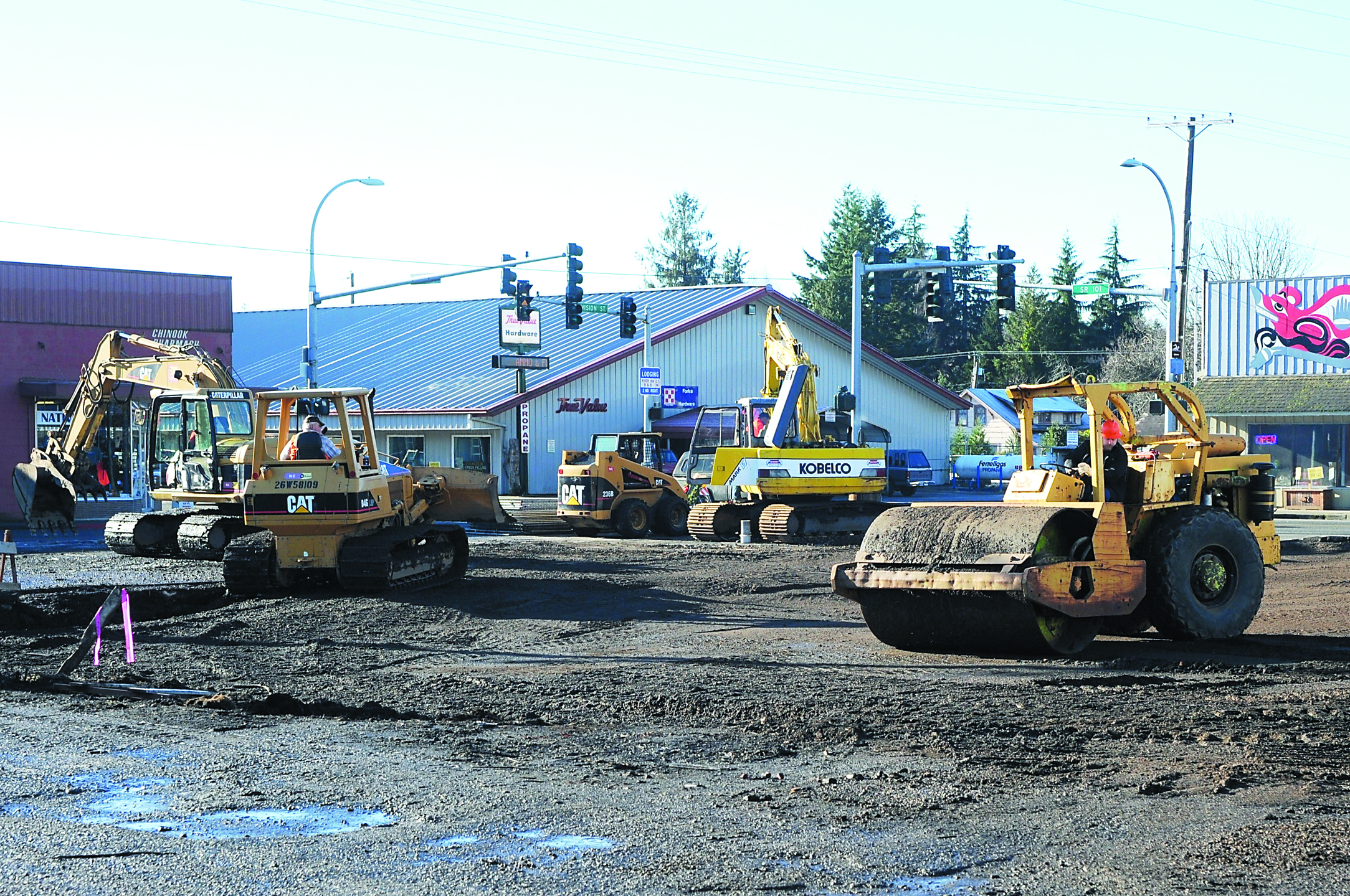 Construction crews level the site that once was occupied by the former Odd Fellows hall and an adjacent store building.  -- Photo by Lonnie Archibald/for Peninsula Daily News