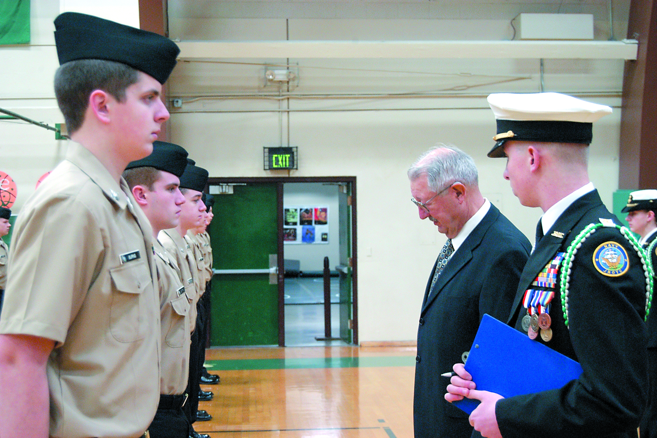 Port Angeles High School’s Navy Junior Reserve Officer Training Corps cadets stand at attention as retired Navy Cmdr. Gary Velie