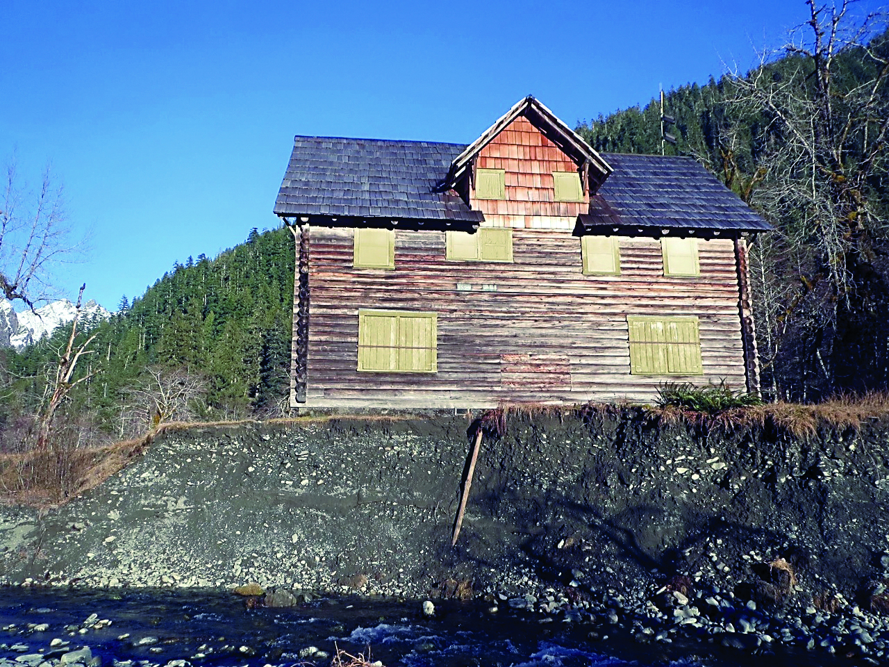 The Enchanted Valley Chalet in Olympic National Park is now dangerously close to the Quinault River after the waterway altered its course. — Olympic National Park