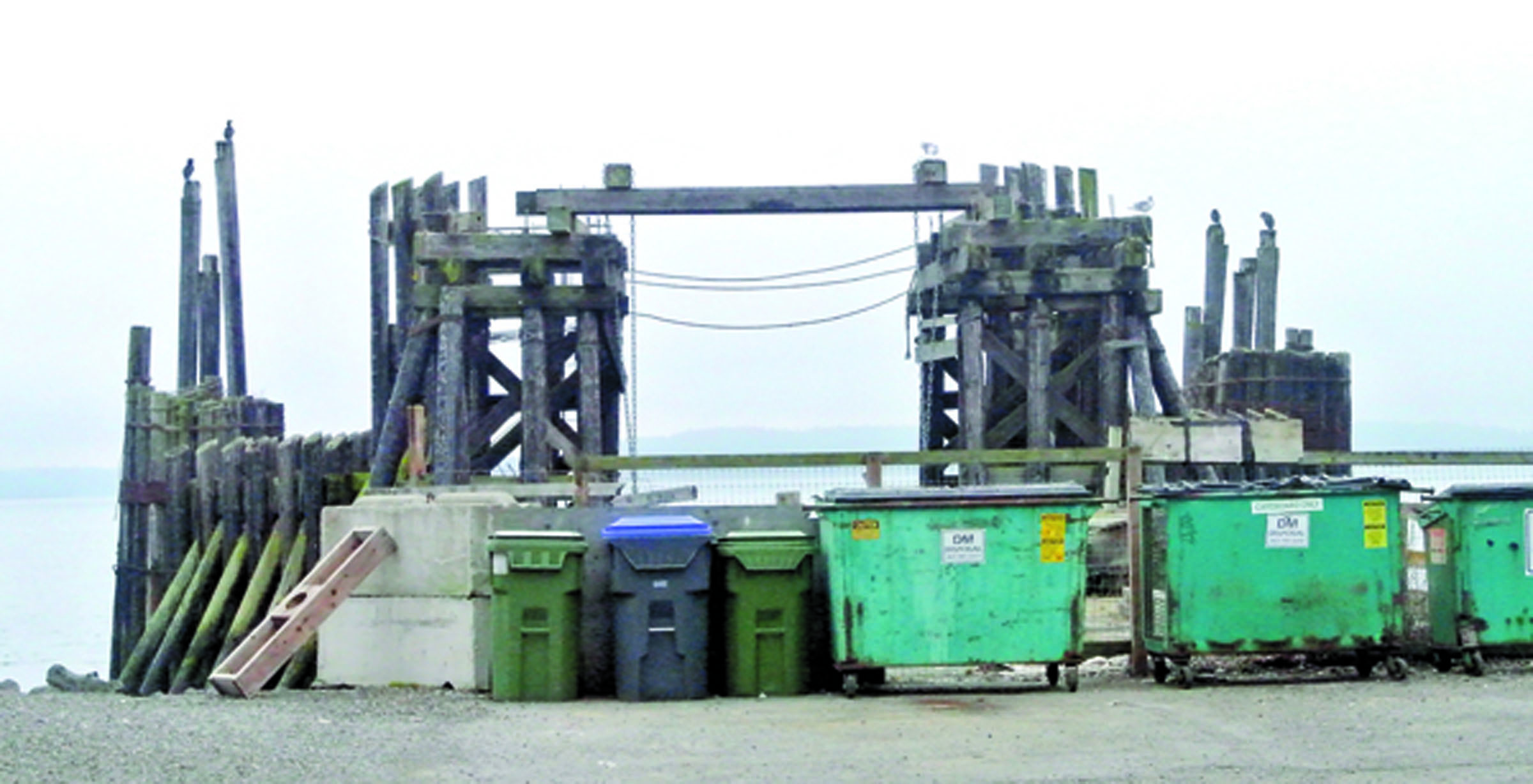 The Esplanade project will convert this area of Quincy Street at the old ferry landing from a trashbin repository.  -- Photo by Charlie Bermant/Peninsula Daily News