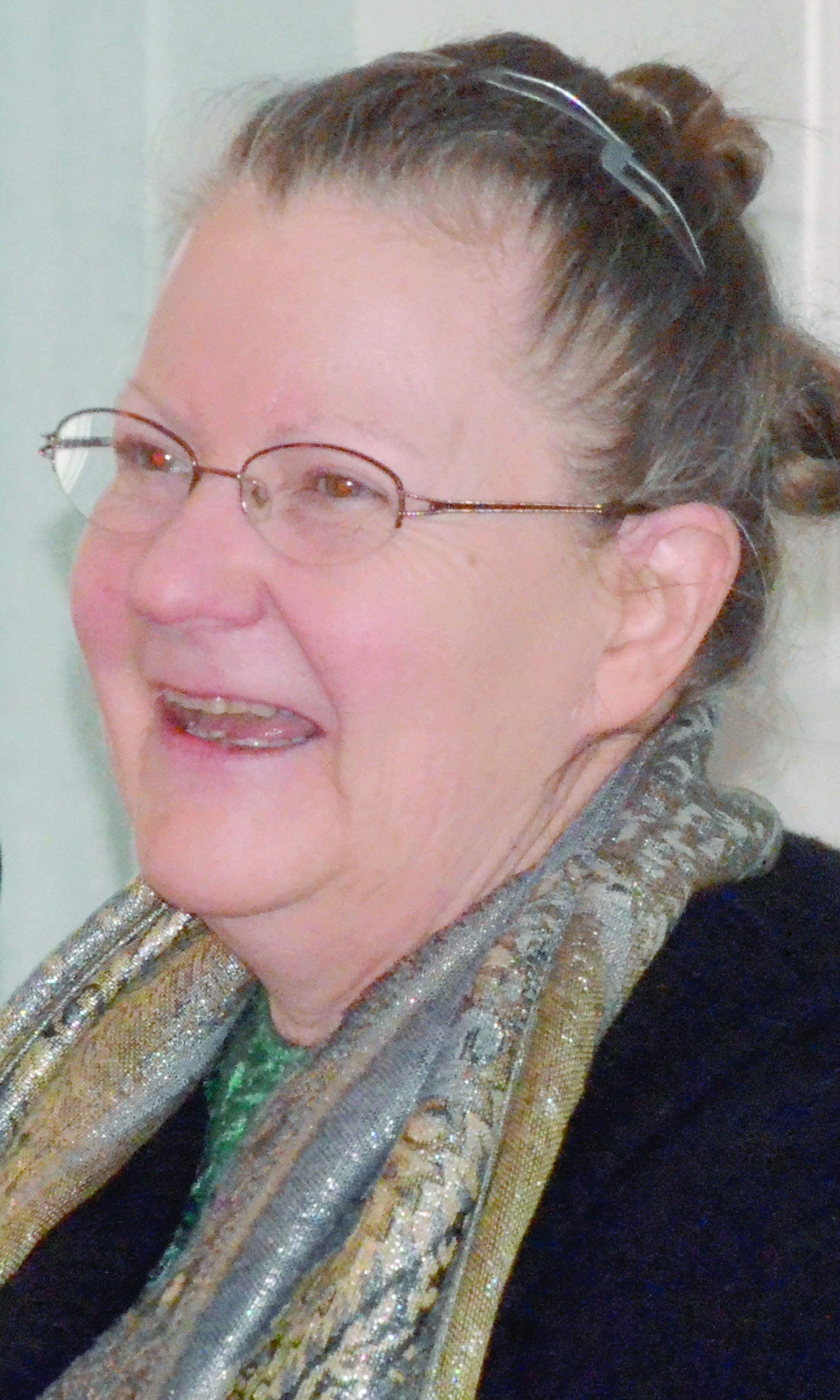 Carolyn Stimbert of the Peninsula Housing Authority speaks to the Jefferson County Chamber of Commerce on Monday. — Charlie Bermant/Peninsula Daily News