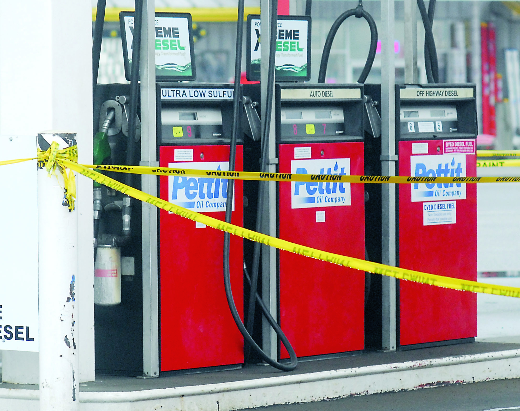 Caution tape surrounds the fuel pumps at a station on Marine Drive in Port Angeles. Pettit Oil provided the fuel for the station before the company's closure. Keith Thorpe/Peninsula Daily News