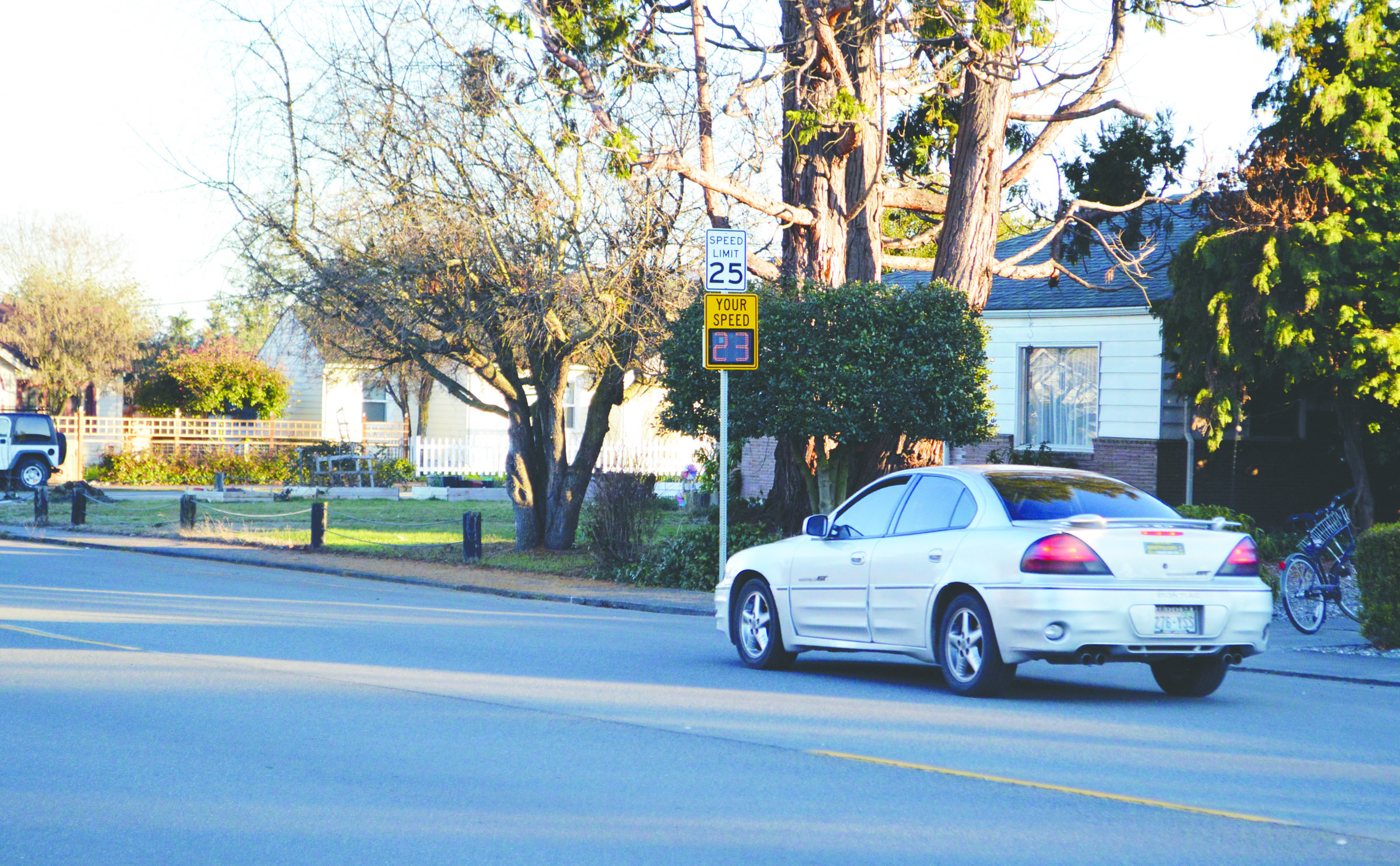 New traffic monitoring signs have been posted on Sequim’s Spruce Street to gauge the speed of passing traffic after neighbors complained of excessive speeding.  —Photo by Joe Smillie/Peninsula Daily News