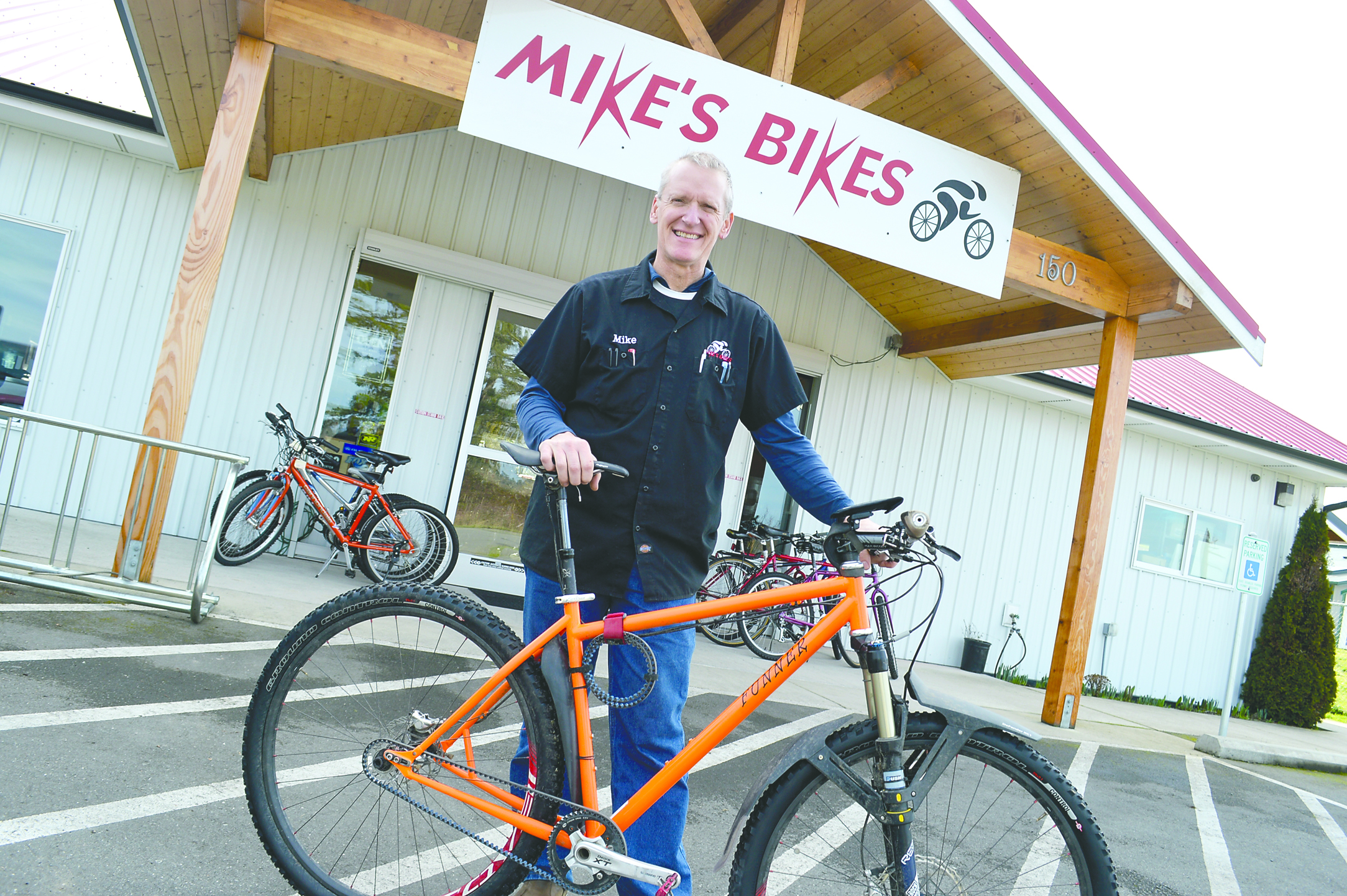 Mike Wanner of Mike’s Bikes in Sequim is changing his shop’s name because a California chain trademarked the “Mike’s Bikes” name.  -- Photo by Joe Smillie/Peninsula Daily News