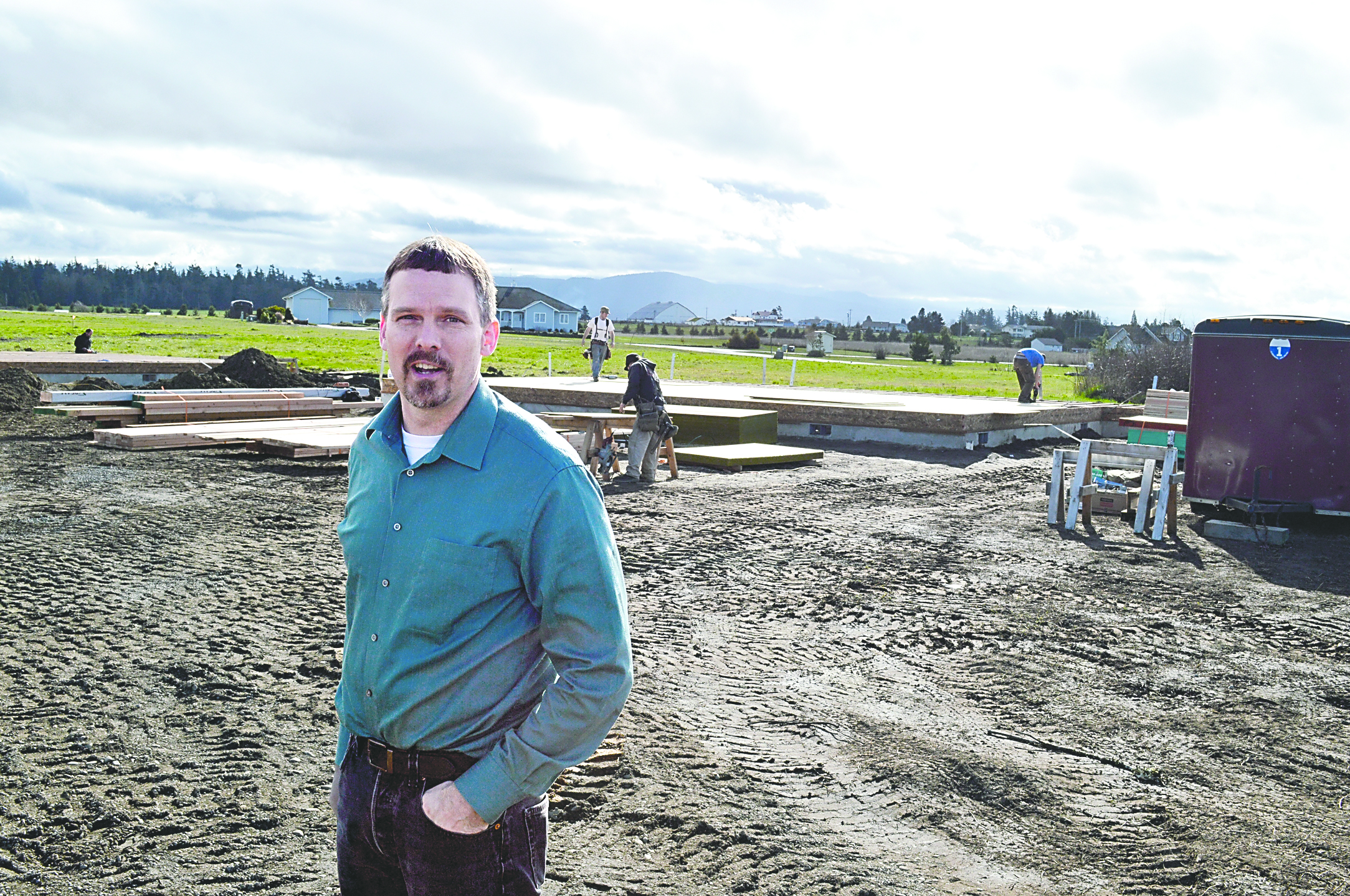 Rick Gross of Estes Builders stands at the construction site of a home on Old Town Road in Dungeness. The home is the first to have a building permit issued under the Dungeness River water rule