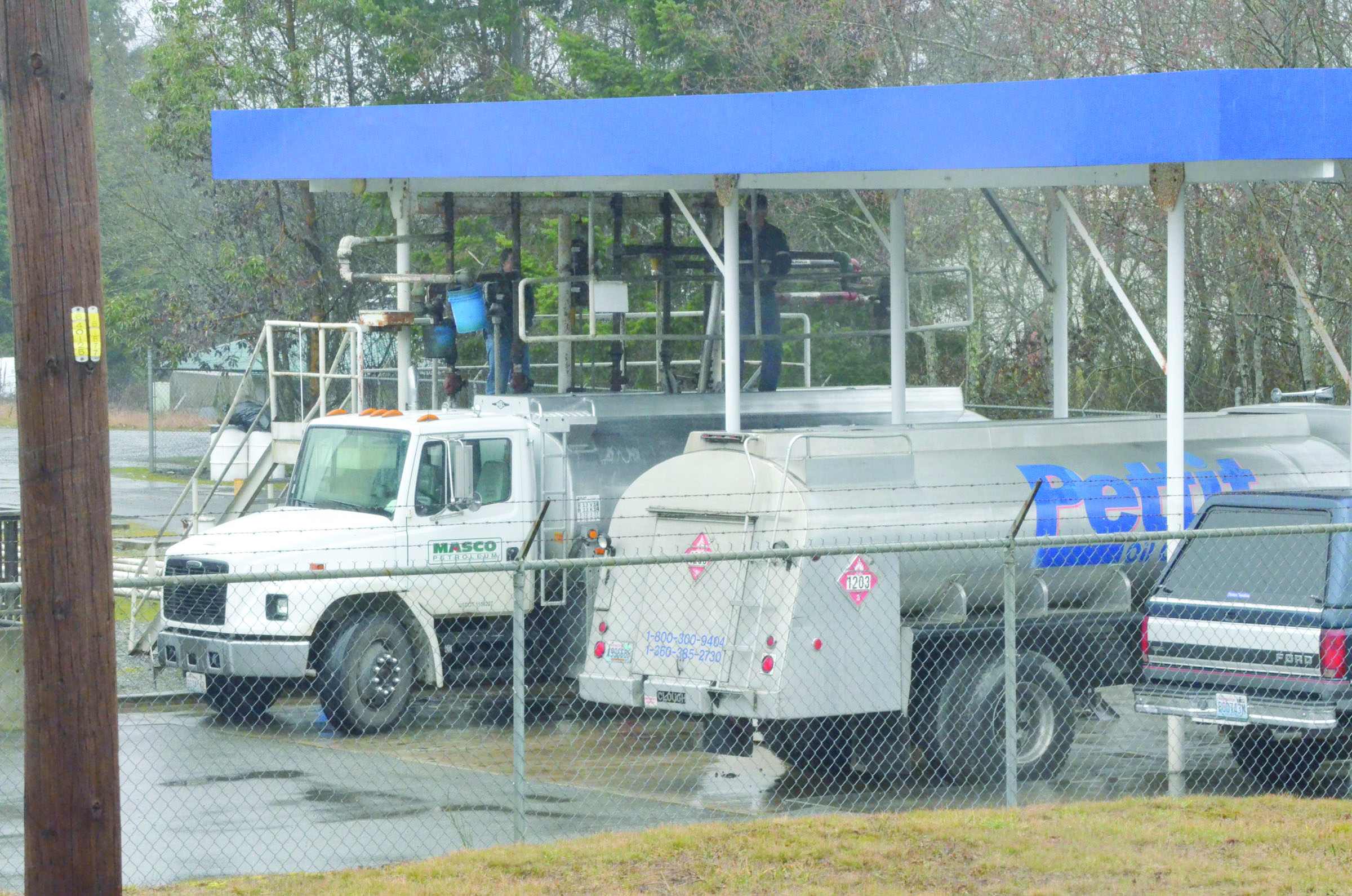 A Port Townsend fuel station once owned by Pettit Oil and recently acquired by Masco Petroleum was visited by vehicles bearing both companies' logos Monday. Charlie Bermant/Peninsula Daily News