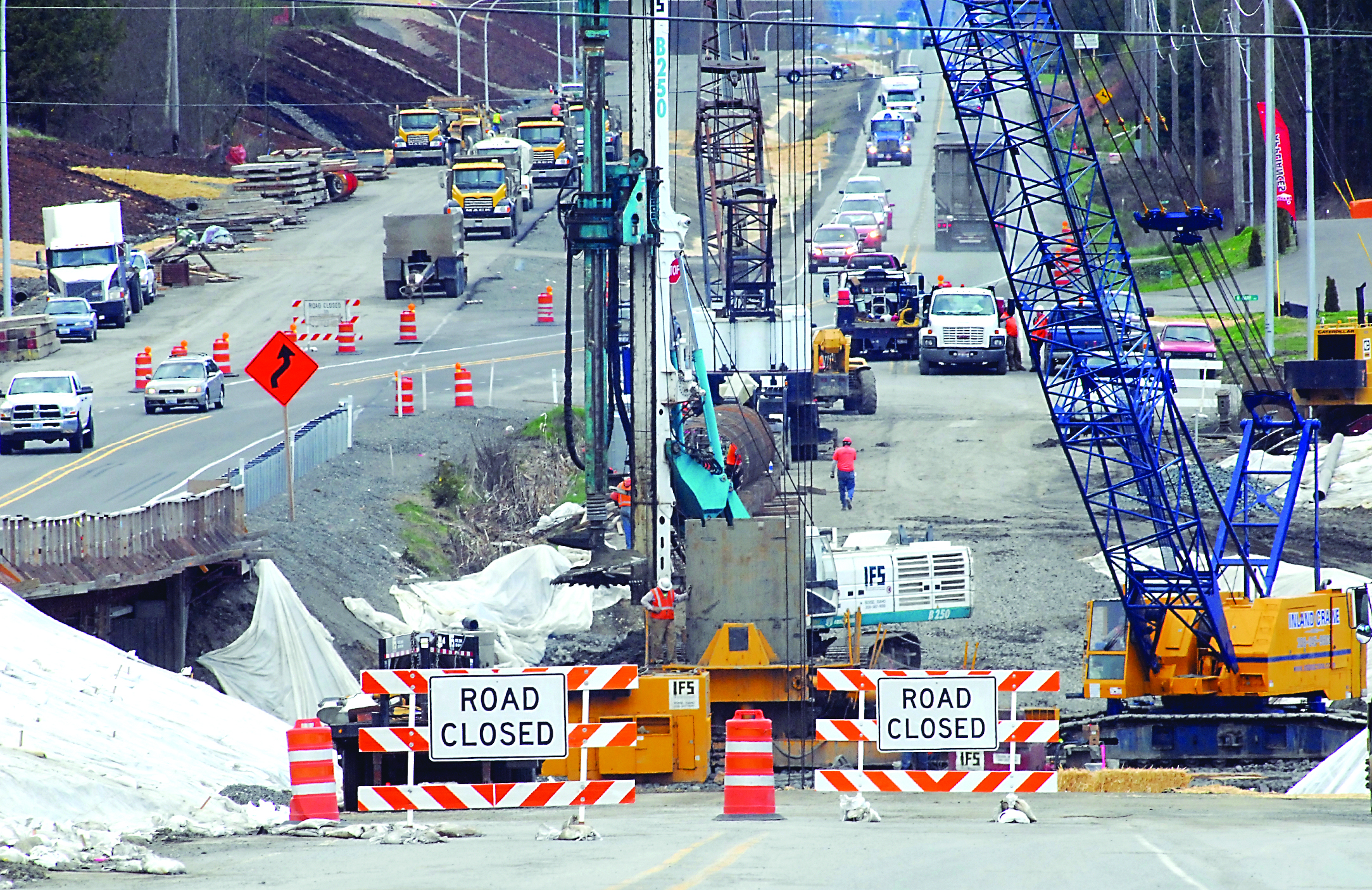 Traffic on U.S. Highway 101 transitions from the old roadway to a new section of road near the site where a second new bridge is being built over McDonald Creek between Port Angeles and Sequim. — Keith Thorpe/Peninsula Daily News