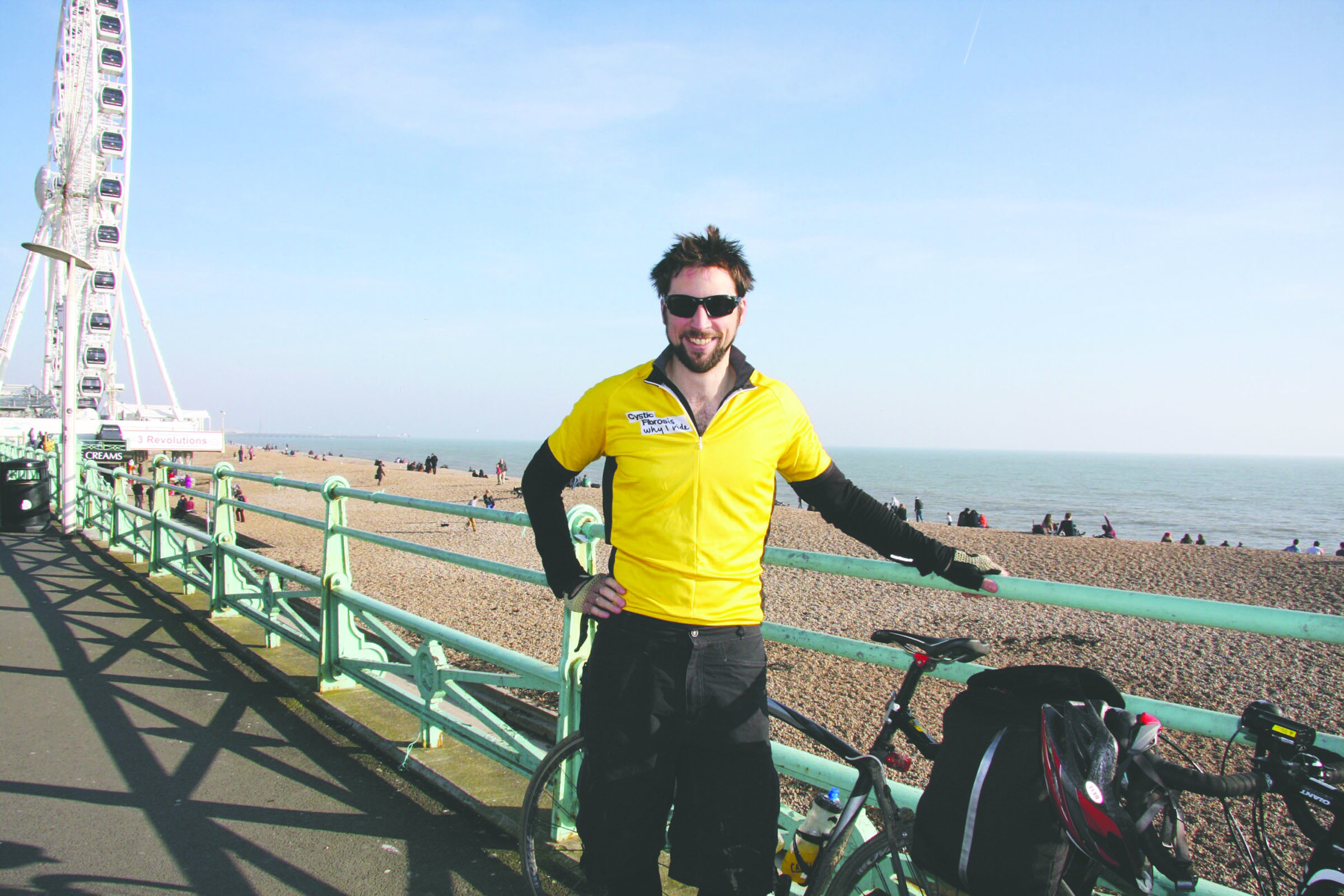 Will King stands on the boardwalk in Brighton