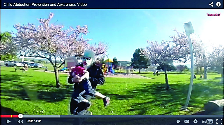 A screen shot from a video of the staged child abduction at Carrie Blake Park in Sequim.  (You can view the video at the end of the news story at left.)