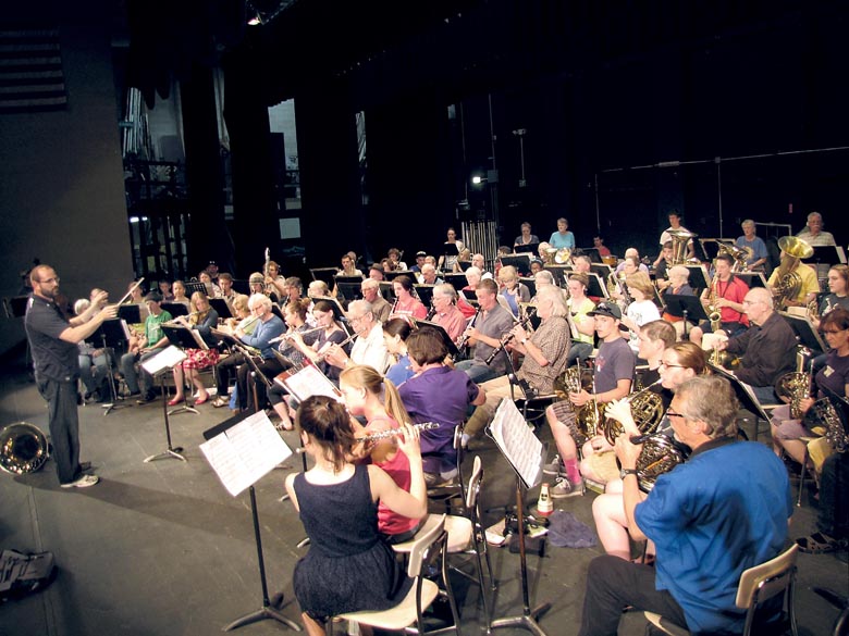 The Port Angeles High School Wind Ensemble and Sequim City Band rehearse Wednesday in preparation for a combined concert Sunday