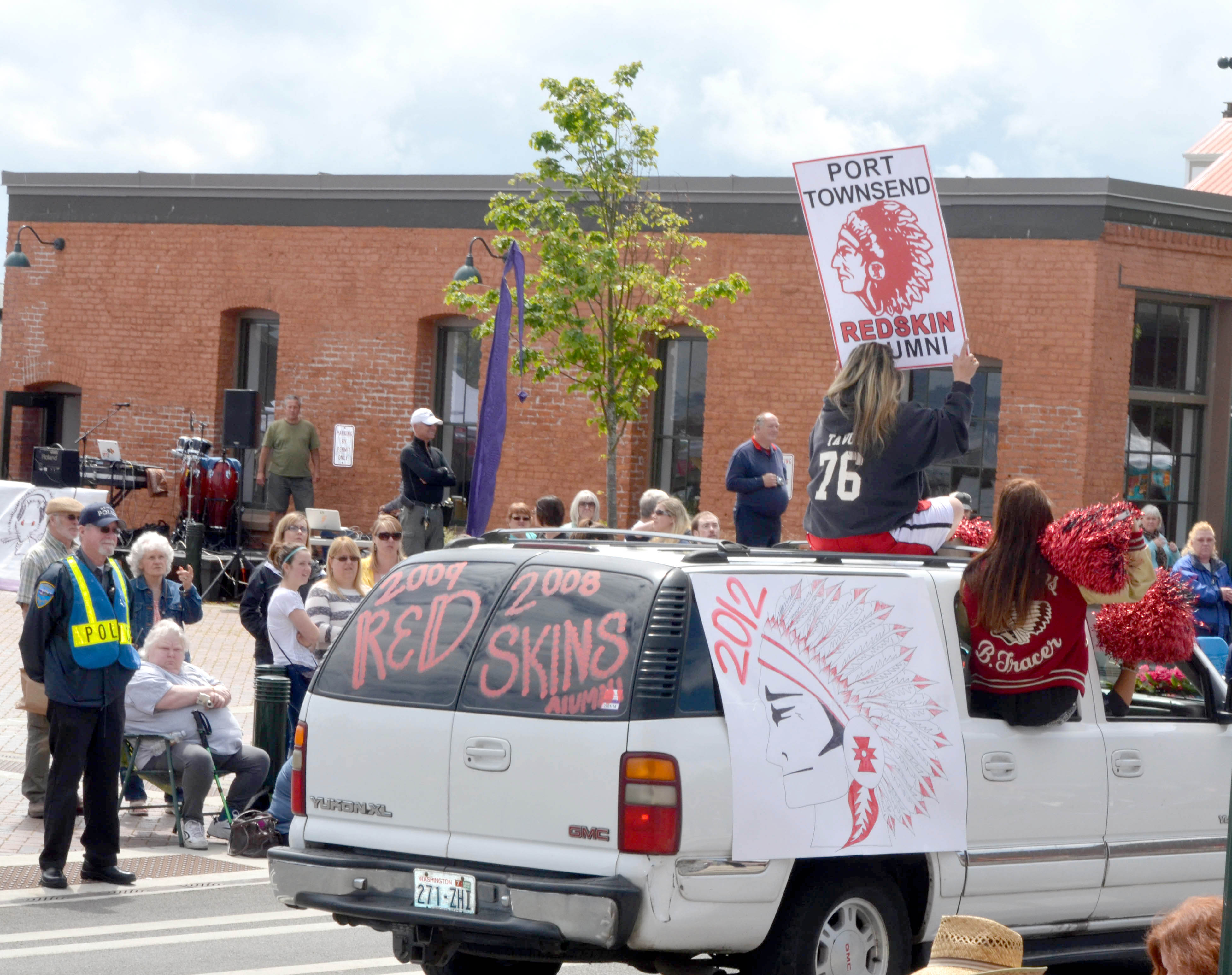 Port Townsend High School alumni show Redskins colors in Saturday's Rhododendron Festival Grand Parade for the last time. The school will adopt a new mascot